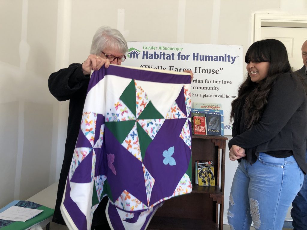Volunteer makes a quilt for each child moving into their Habitat home